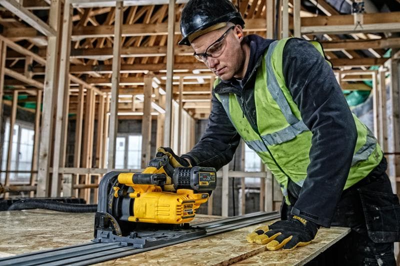 DEWALT DCS520T2-XE, DCS520T2 in use in construction. Worker operates yellow photography tool on wooden board.